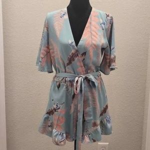 Blue Blush Womens Tropical Flora Print
Short Sleeve Ruffle Hem Romper Size S